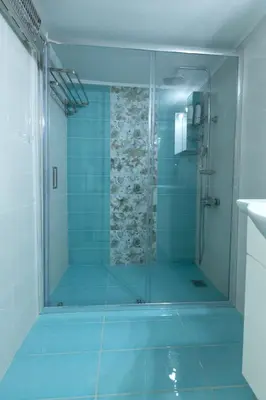 a shower with a glass door in a bathroom at Athens center traditional & classic 2BR apartment in Mesochórion