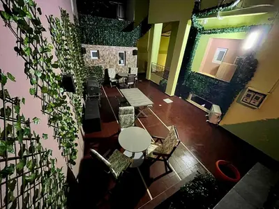 an overhead view of a room with a table and plants at knezevic resorts 14 in Athens