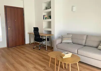 a living room with a couch and a table at Quiet Central 2-bedroom Flat 4' to Metro & Shops in Athens
