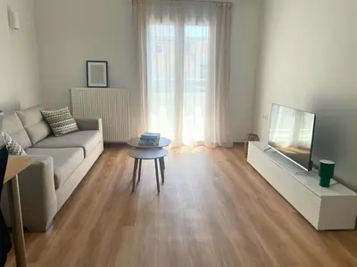 a living room with a couch and a tv at Quiet Central 2-bedroom Flat 4' to Metro & Shops in Athens