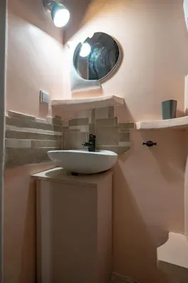 a bathroom with a sink and a mirror at Athenian Getaway near Metro-Agios Nikolaos by ΜΡS in Athens
