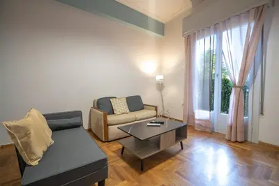 a living room with a couch and a coffee table at Athenian Getaway near Metro-Agios Nikolaos by ΜΡS in Athens