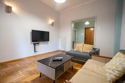 a living room with a couch and a coffee table at Athenian Getaway near Metro-Agios Nikolaos by ΜΡS in Athens