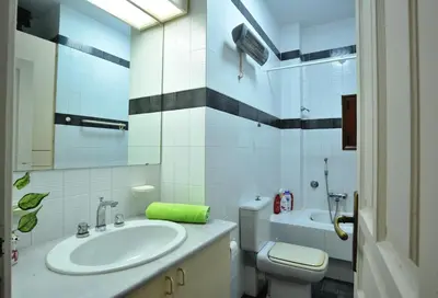 a bathroom with a sink and a toilet at Villa Almy - shared pool with 1 house in Anavissos