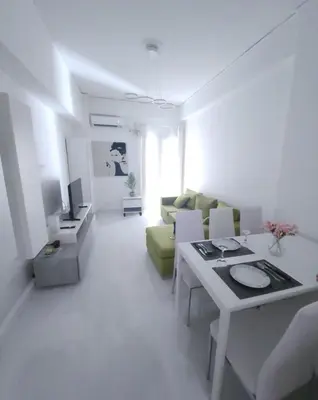 a living room with a couch and a table at Elegant-Quiet 2' Metro Center in Athens