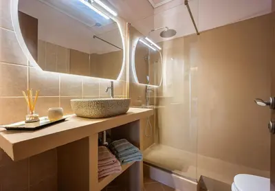 a bathroom with a sink and a shower at Komis House - Cozy Stay near Metro in Athens