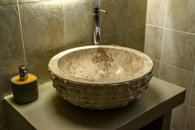 a bathroom with a bowl sink with a faucet at Komis House - Cozy Stay near Metro in Athens