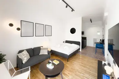 a living room with a couch and a table at Athens Vibes City Studio in Athens