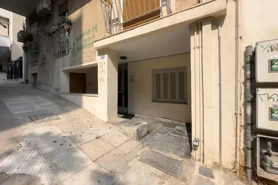 an empty alley with a building and a sign on it at Athens Vibes City Studio in Athens