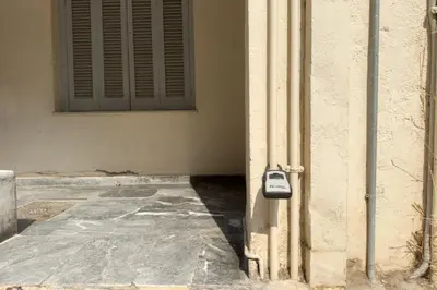 a phone is attached to the side of a building at Athens Vibes City Studio in Athens