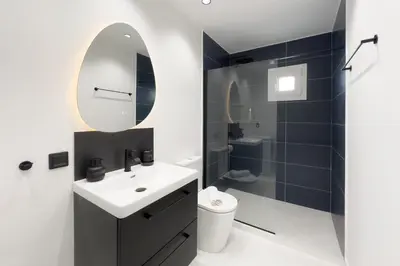 a bathroom with a sink and a mirror at Athens Vibes City Studio in Athens