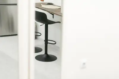 a table and a chair in a room at My Athens Home near Metro Station in Athens