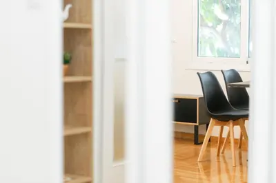 a room with chairs and a table and a window at My Athens Home near Metro Station in Athens