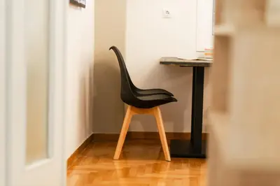 a black chair sitting in front of a desk at My Athens Home near Metro Station in Athens