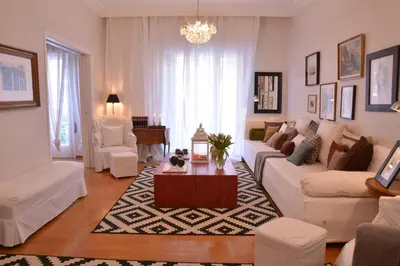 a living room with a couch and a coffee table at Detached House 4km away from Acropolis & Riviera in Athens