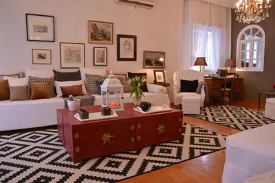 a living room with a couch and a coffee table at Detached House 4km away from Acropolis & Riviera in Athens