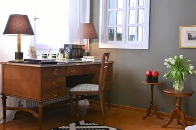 an office with a desk and a chair with two lamps at Detached House 4km away from Acropolis & Riviera in Athens