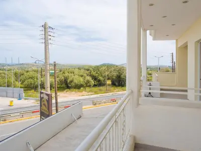 a balcony with a view of a road at Roof Top Apartment By Athens Airport in Spáta