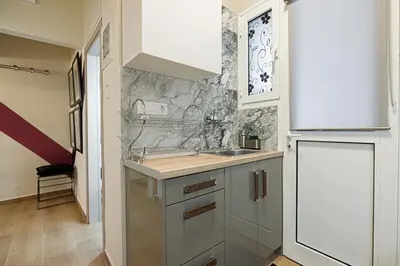 a kitchen with a sink and a refrigerator at Regal Studio Athens in Athens