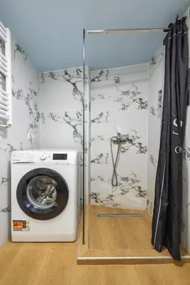 a washing machine in a bathroom with a shower at Regal Studio Athens in Athens