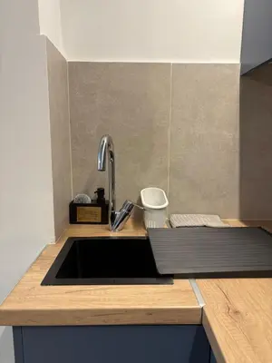 a kitchen counter with a sink and a sink at Relax adobe in central Athens in Athens