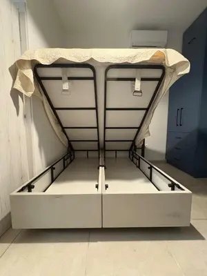 a bed in a room with a bed frame at Relax adobe in central Athens in Athens