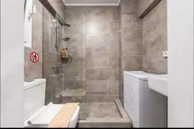 a bathroom with a shower and a toilet and a sink at The Kallithea Spot Studio 1 in Athens