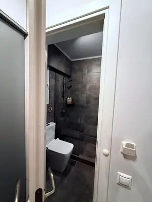 a bathroom with a toilet and a shower at The Kallithea Spot Studio 1 in Athens