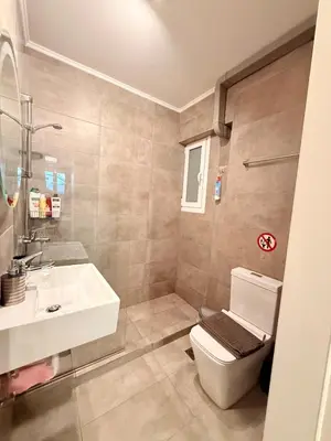 a bathroom with a toilet and a sink at The Kallithea Spot Studio 2 in Athens