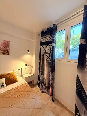 a room with a bed and a window at The Kallithea Spot Studio 2 in Athens