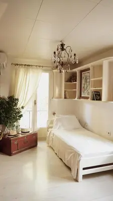 a bedroom with a white bed and a window at Villa Lagonisi, magnificent Villa in the Athenian Riviera in Áyios Nikólaos