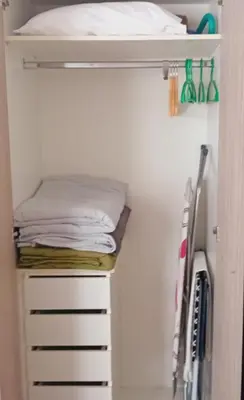 a closet with a bunk bed and towels at Akrivis studio in Athens