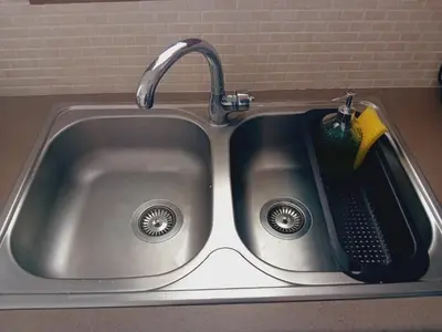 a kitchen sink with a faucet and a sponge at Akrivis studio in Athens