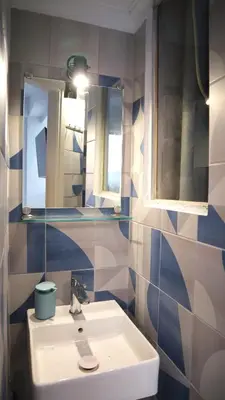a bathroom with a sink and a mirror at A room with a view in Athens