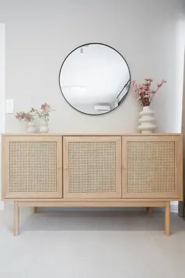a mirror on top of a wooden dresser at LIV - Deluxe 2BD Apartment in Athens in Athens