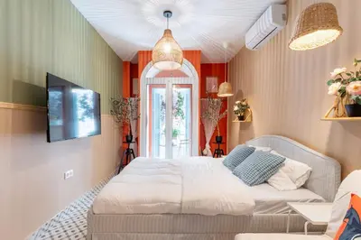 a bedroom with a bed and a window at Chilli & Chill in Athens