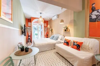 a living room with a couch and a table at Chilli & Chill in Athens