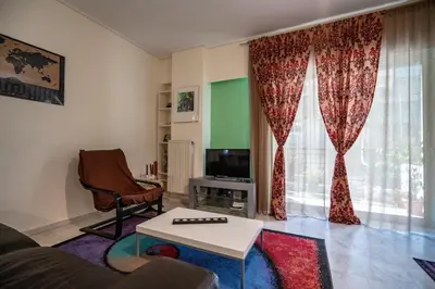 a living room with a couch and a table at Chic 2-Bdrm Oasis in Pangrati by ΜΡS in Athens
