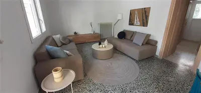 a living room with a couch and a table at Archontiko Voulas D in Athens