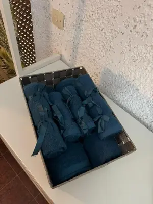 a box of blue ties sitting on a table at Aggelakos Rooms in Porto Rafti