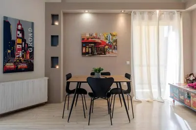 a dining room with a table and chairs at Modern Greek Escape close to Alimos Shore in Athens