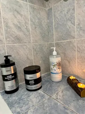 three bottles of cosmetics sitting on a counter at Gaia Casa Athens in Athens