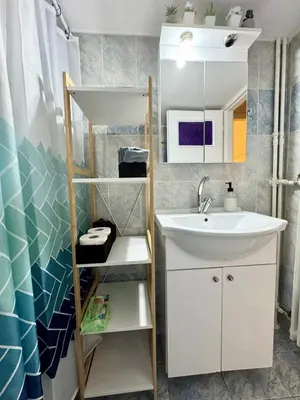 a bathroom with a sink and a mirror at Gaia Casa Athens in Athens