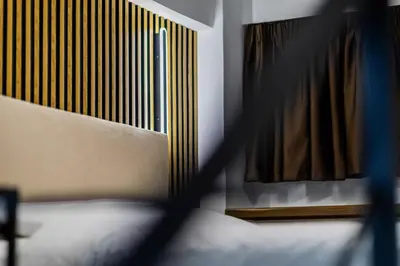 a close up of a bedroom with a bed and a window at Studio Terra in Athens