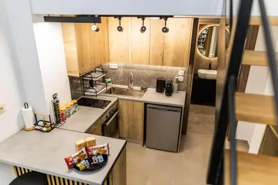 a small kitchen with a sink and a counter at Studio Terra in Athens