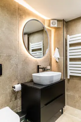 a bathroom with a sink and a mirror at Studio Terra in Athens