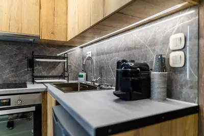 a kitchen counter with a sink and a mixer at Studio Terra in Athens