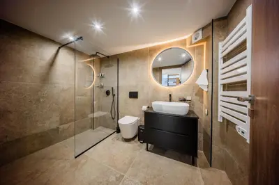 a bathroom with a sink and a glass shower at Studio Terra in Athens