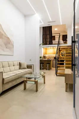 a living room with a couch and a table at Studio Terra in Athens