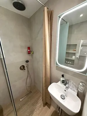 a bathroom with a sink and a shower at TAVROS suites in Athens